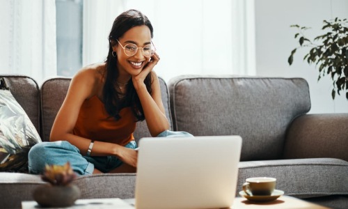 Woman watching a video on her laptop